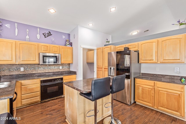 kitchen featuring decorative backsplash, appliances with stainless steel finishes, dark hardwood / wood-style floors, and sink