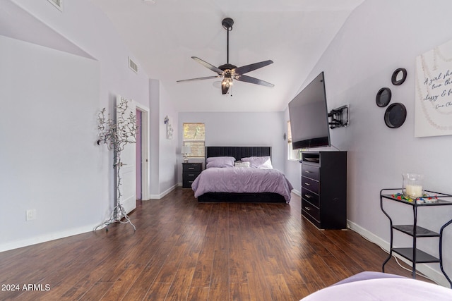 bedroom featuring ceiling fan, dark hardwood / wood-style flooring, and lofted ceiling