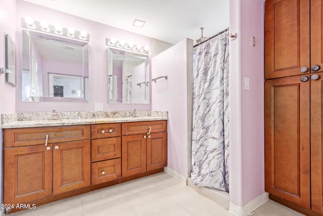 bathroom with vanity and curtained shower