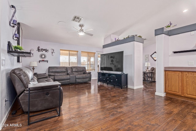 living room featuring ceiling fan and dark hardwood / wood-style flooring