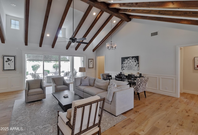 3813 N 37th St, Phoenix, AZ 85018 - living room with a decorative wall, beamed ceiling, recessed lighting, light wood-style floors, and high vaulted ceiling