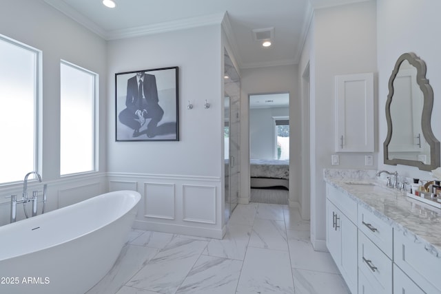 3813 N 37th St, Phoenix, AZ 85018 - ensuite bathroom featuring marble finish floors, vanity, a freestanding bath, crown molding, and a wainscoted wall