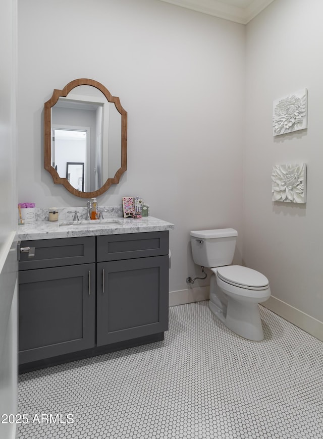 3813 N 37th St, Phoenix, AZ 85018 - bathroom with toilet, vanity, baseboards, and crown molding