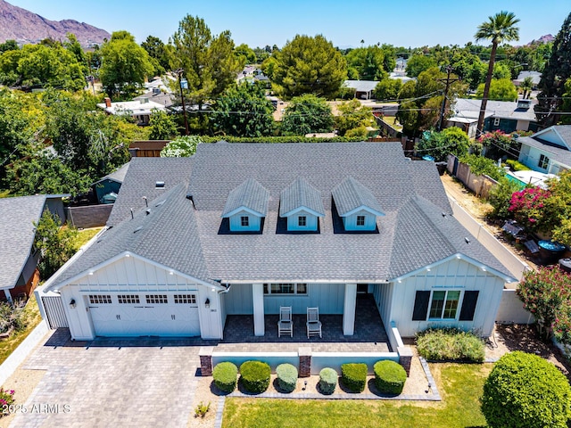 3813 N 37th St, Phoenix, AZ 85018 - view of front of house featuring board and batten siding, roof with shingles, an attached garage, and decorative driveway