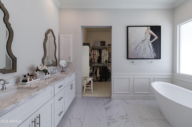 3813 N 37th St, Phoenix, AZ 85018 - bathroom featuring double vanity, healthy amount of natural light, marble look tile flooring, a soaking tub, and ornamental molding
