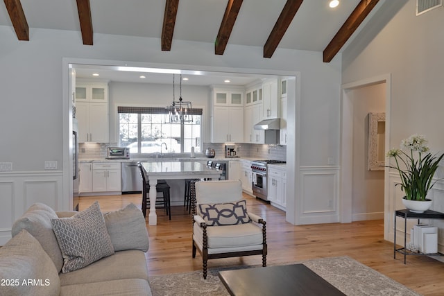 3813 N 37th St, Phoenix, AZ 85018 - living area featuring recessed lighting, light wood-style floors, and a chandelier