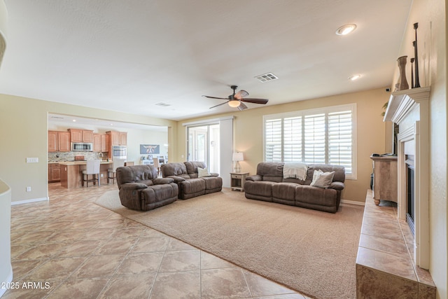 2514 E Grand Canyon Dr, Chandler, AZ 85249 - living area featuring a fireplace, a ceiling fan, and recessed lighting