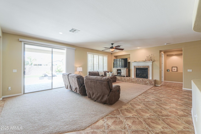 2514 E Grand Canyon Dr, Chandler, AZ 85249 - living room featuring ceiling fan and a tiled fireplace