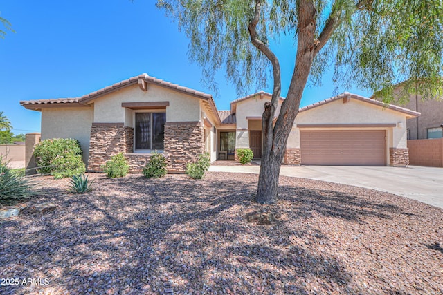 2514 E Grand Canyon Dr, Chandler, AZ 85249 - mediterranean / spanish-style house featuring stone siding, stucco siding, an attached garage, driveway, and a tiled roof