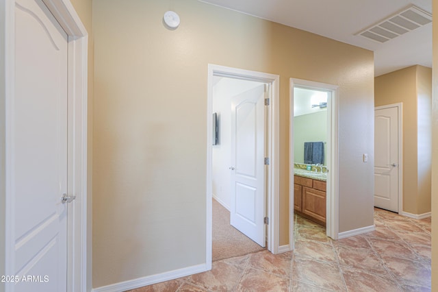 2514 E Grand Canyon Dr, Chandler, AZ 85249 - hallway with baseboards and a sink