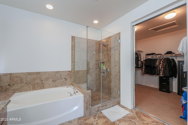 2514 E Grand Canyon Dr, Chandler, AZ 85249 - bathroom featuring a garden tub, a stall shower, a spacious closet, and recessed lighting