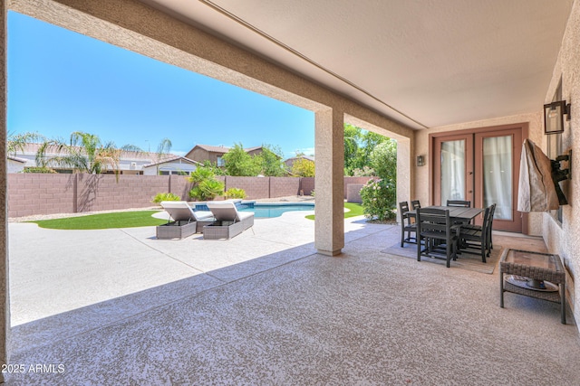 2514 E Grand Canyon Dr, Chandler, AZ 85249 - fenced backyard with a patio area, outdoor dining space, and french doors