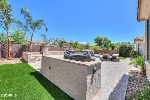 2514 E Grand Canyon Dr, Chandler, AZ 85249 - fenced backyard with a patio area and a grill