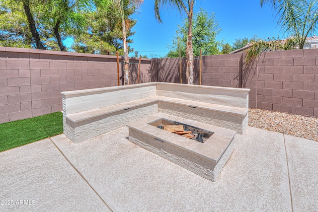 2514 E Grand Canyon Dr, Chandler, AZ 85249 - fenced backyard featuring an outdoor fire pit and a patio