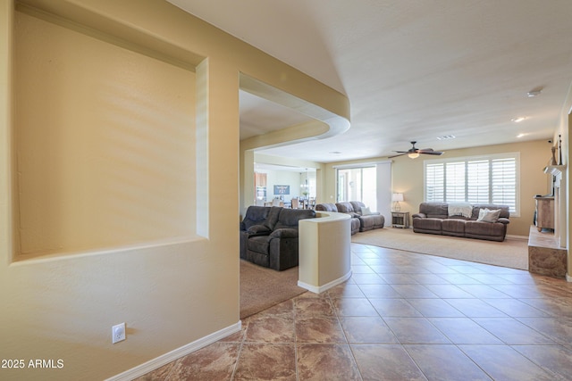 2514 E Grand Canyon Dr, Chandler, AZ 85249 - carpeted living room featuring ceiling fan and tile patterned floors