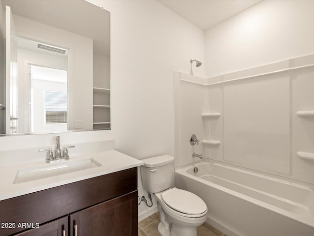 full bathroom featuring toilet, vanity, tile patterned flooring, and bathing tub / shower combination