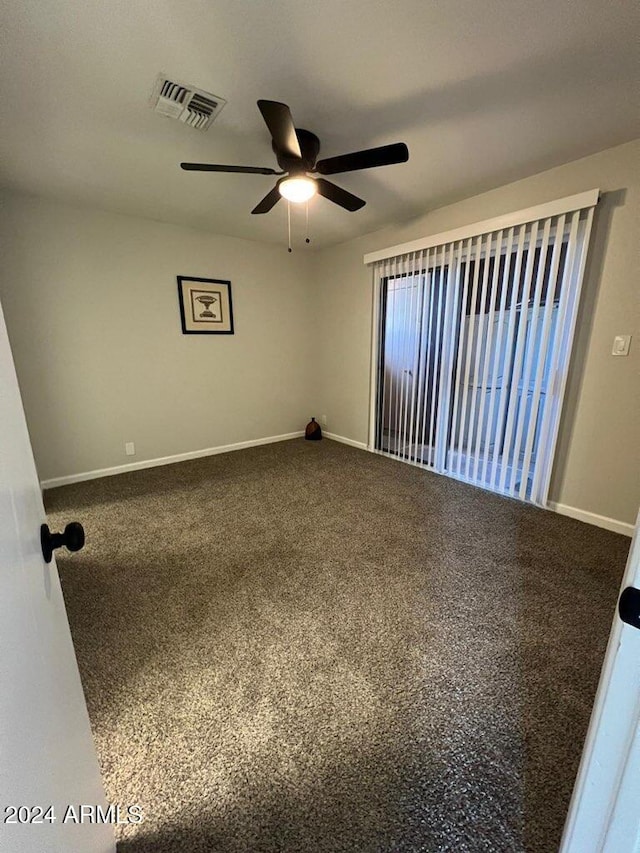 carpeted empty room with ceiling fan