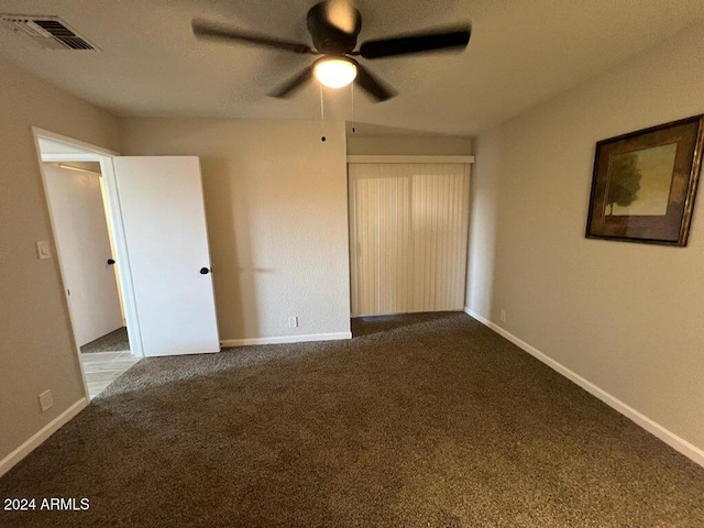 unfurnished bedroom featuring carpet flooring and ceiling fan