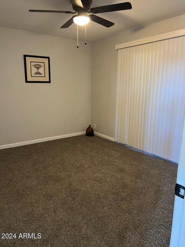 carpeted empty room with ceiling fan