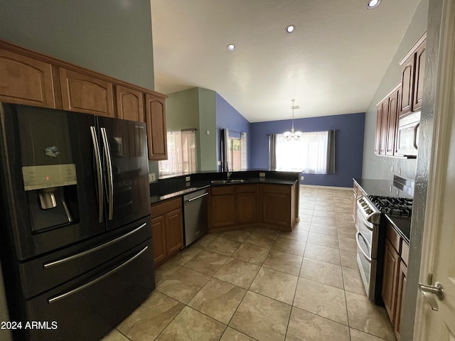 kitchen with decorative light fixtures, lofted ceiling, sink, kitchen peninsula, and stainless steel appliances