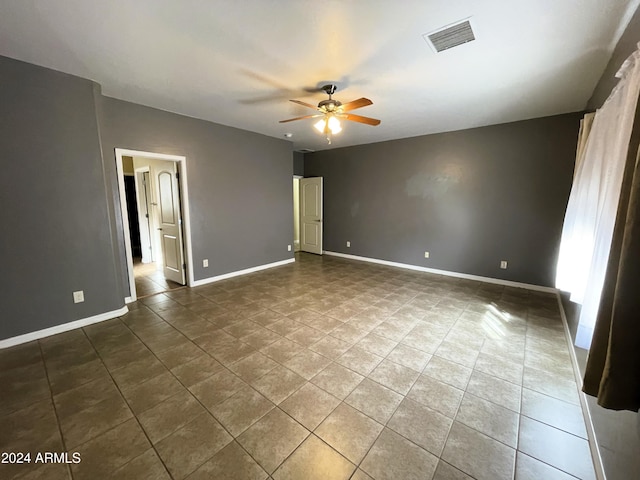 unfurnished bedroom with tile patterned flooring and ceiling fan