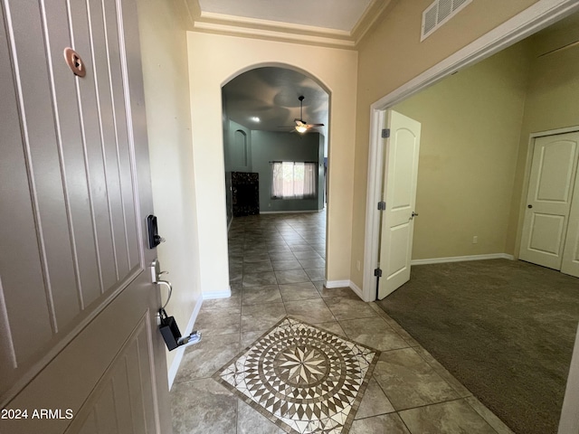 corridor featuring light colored carpet