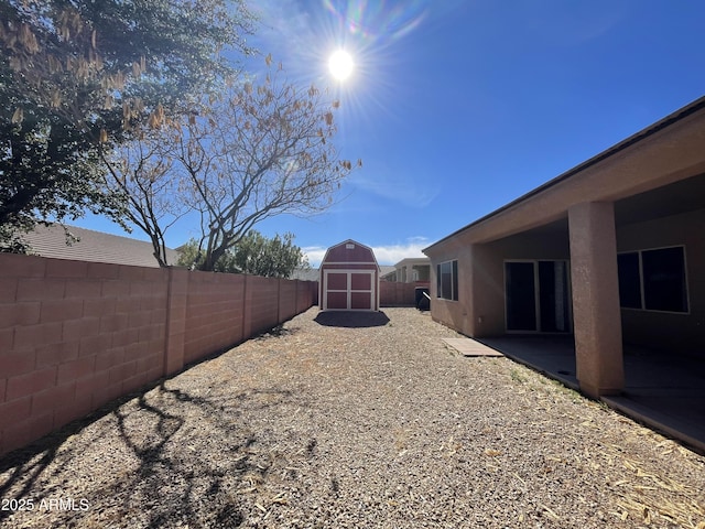 view of yard with a patio area and a shed