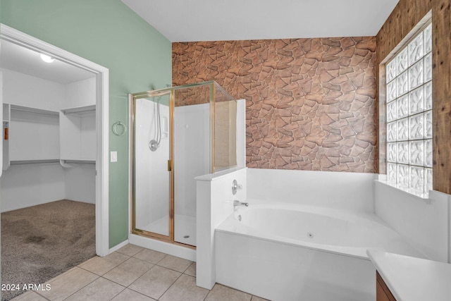 bathroom with tile patterned flooring, vanity, and independent shower and bath