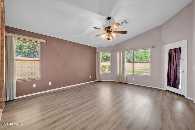 spare room featuring hardwood / wood-style flooring, ceiling fan, and lofted ceiling