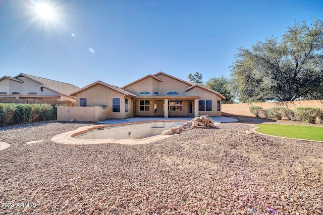 back of property featuring a patio area