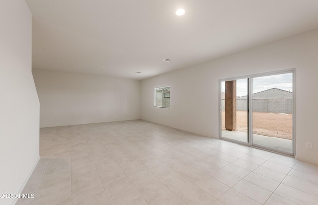 empty room featuring recessed lighting and light tile patterned floors
