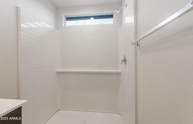 bathroom featuring vanity and a shower