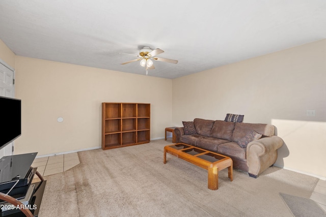 living room featuring ceiling fan, carpet, and baseboards