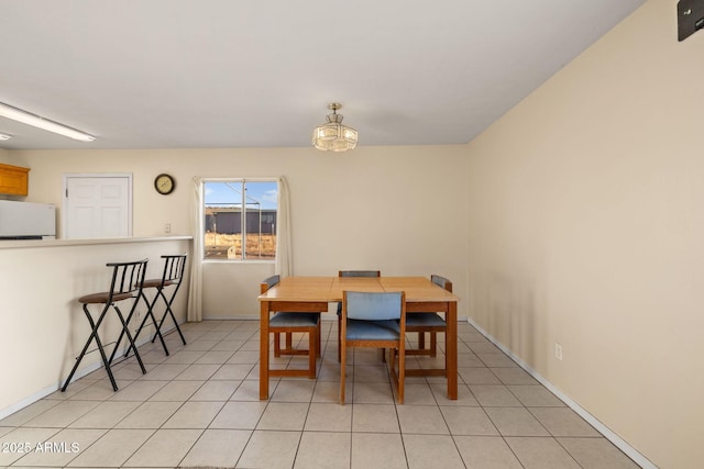 dining room featuring light tile patterned floors