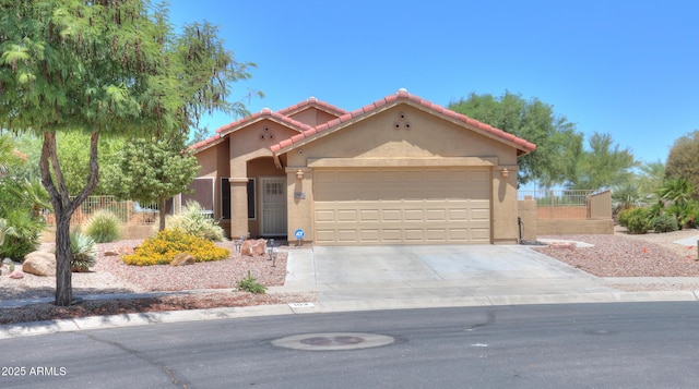 103 S Birdie Way, Casa Grande, AZ 85194 - mediterranean / spanish home with a tile roof, stucco siding, an attached garage, and concrete driveway