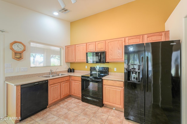 103 S Birdie Way, Casa Grande, AZ 85194 - kitchen with black appliances, light brown cabinetry, light tile patterned floors, a towering ceiling, and light countertops