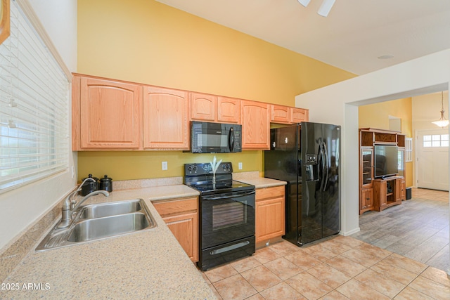 103 S Birdie Way, Casa Grande, AZ 85194 - kitchen with black appliances, light countertops, light brown cabinets, light tile patterned flooring, and ceiling fan