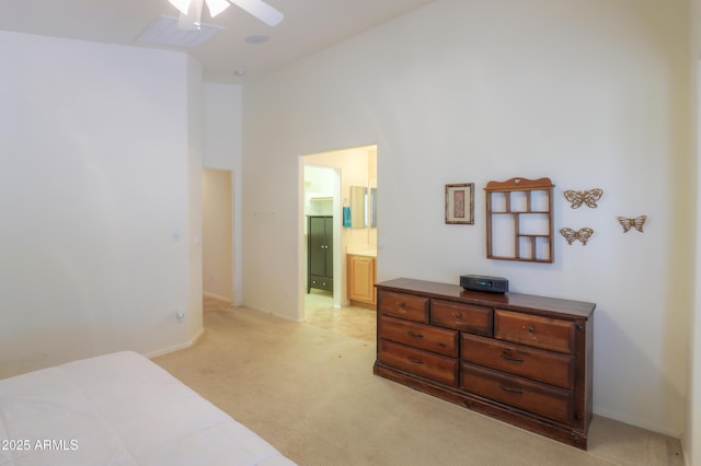 103 S Birdie Way, Casa Grande, AZ 85194 - bedroom with light carpet, ensuite bath, and ceiling fan