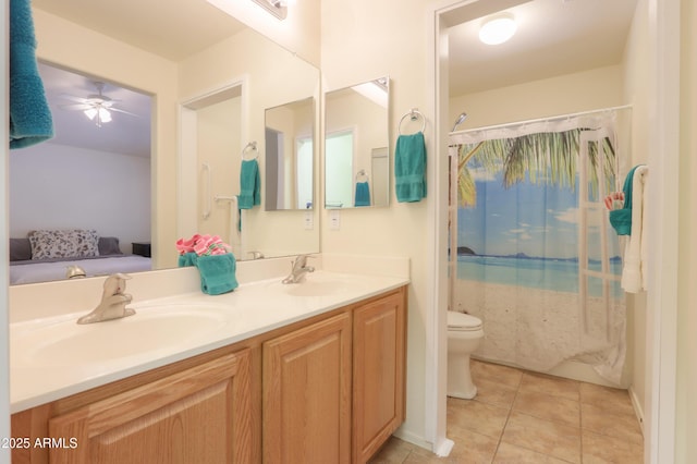 103 S Birdie Way, Casa Grande, AZ 85194 - ensuite bathroom with double vanity, tile patterned floors, and a ceiling fan