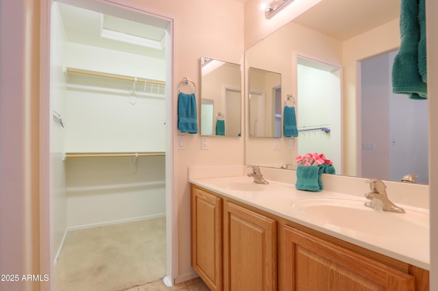 103 S Birdie Way, Casa Grande, AZ 85194 - bathroom featuring double vanity and a walk in closet