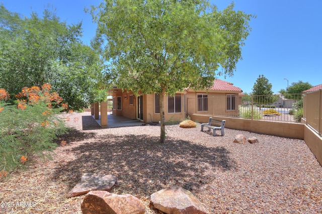 103 S Birdie Way, Casa Grande, AZ 85194 - back of property with stucco siding and a patio