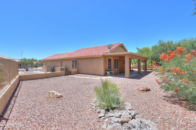 103 S Birdie Way, Casa Grande, AZ 85194 - rear view of property with a patio area, stucco siding, and a tile roof