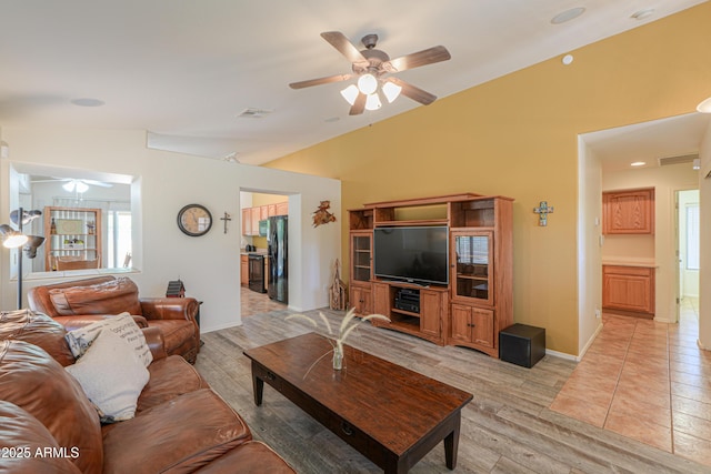 103 S Birdie Way, Casa Grande, AZ 85194 - living area featuring ceiling fan, lofted ceiling, and light wood-style flooring