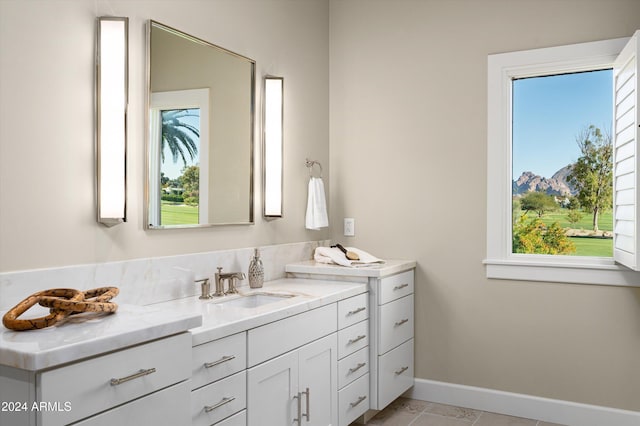 bathroom with plenty of natural light and vanity