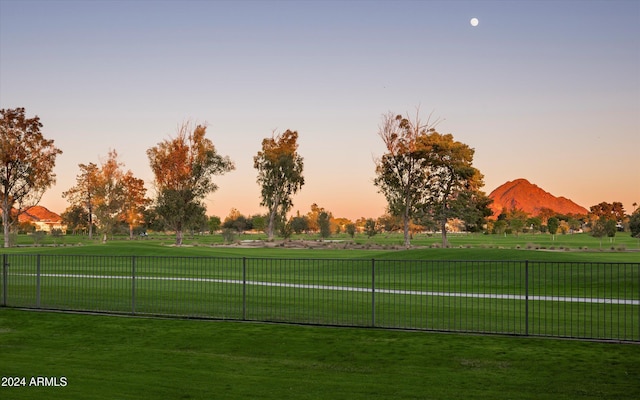 view of home's community featuring a mountain view and a lawn