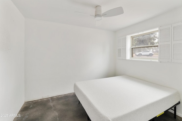 bedroom with concrete flooring and ceiling fan