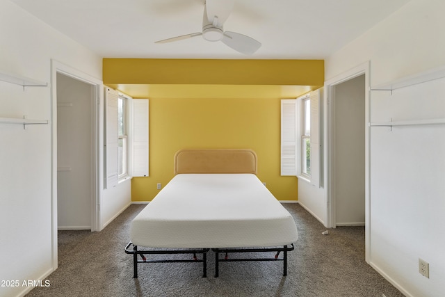 bedroom featuring a ceiling fan, baseboards, and carpet floors