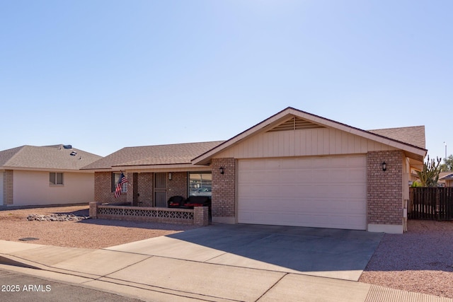 ranch-style house featuring a porch and a garage