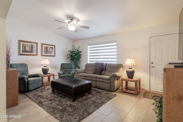 living room with ceiling fan and vaulted ceiling