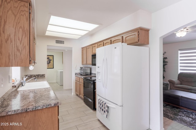 kitchen featuring black appliances and sink